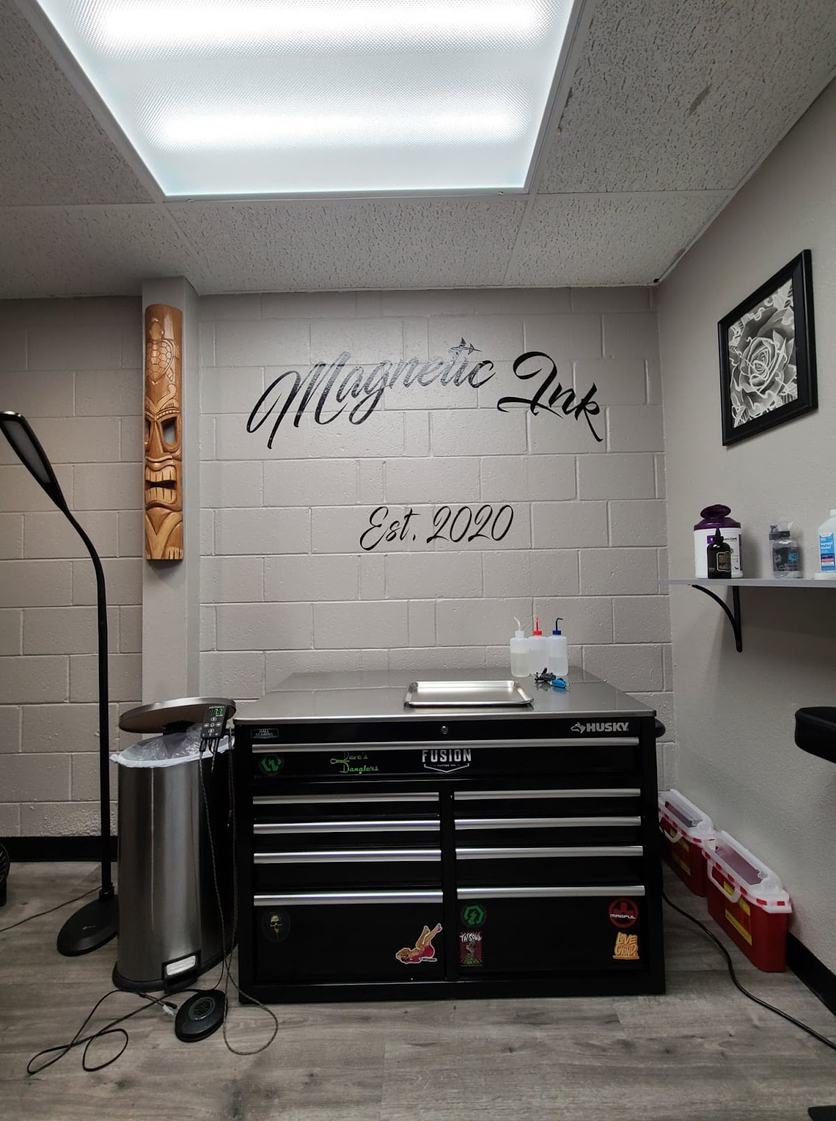 Magnetic Ink studio interior with the shop's script logo, Est. 2020